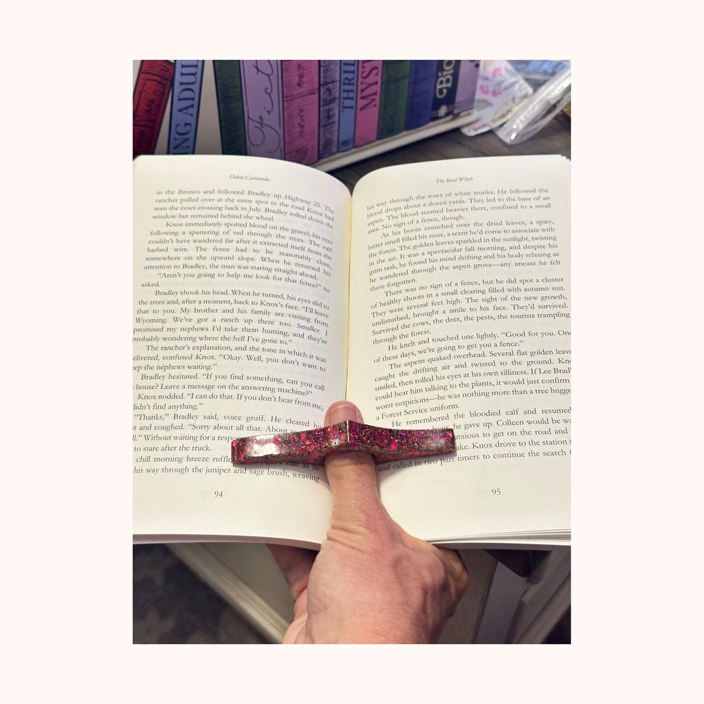 Custom page holder in use with an open book
