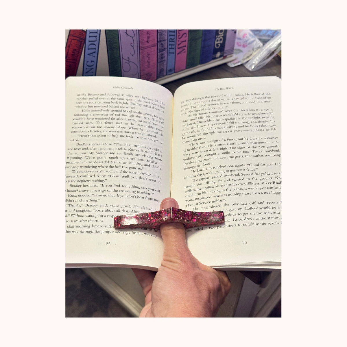 Custom page holder in use with an open book