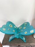 Turquoise butterfly-shaped resin book stand with dried flowers